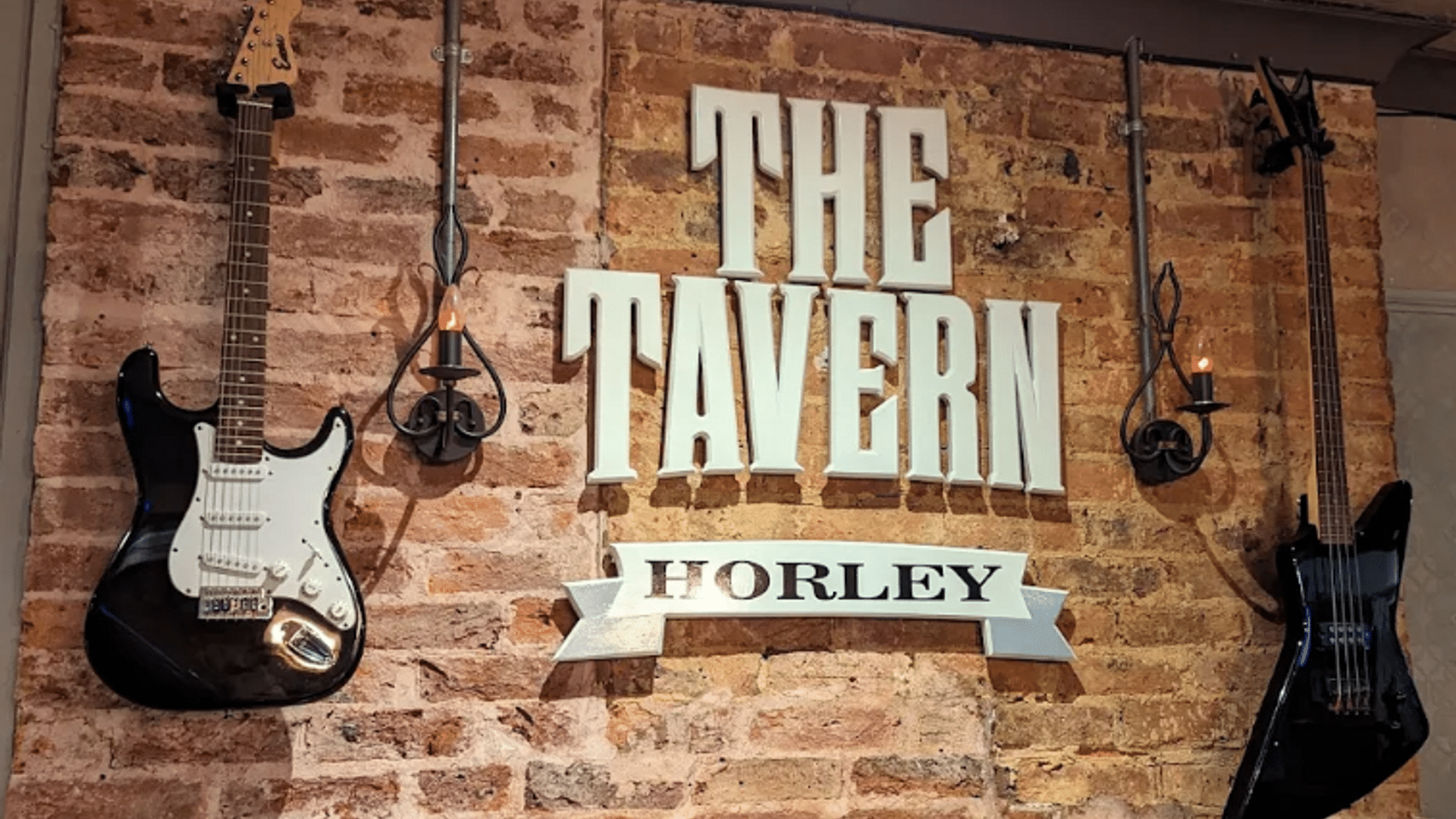The Tavern logo on a wall