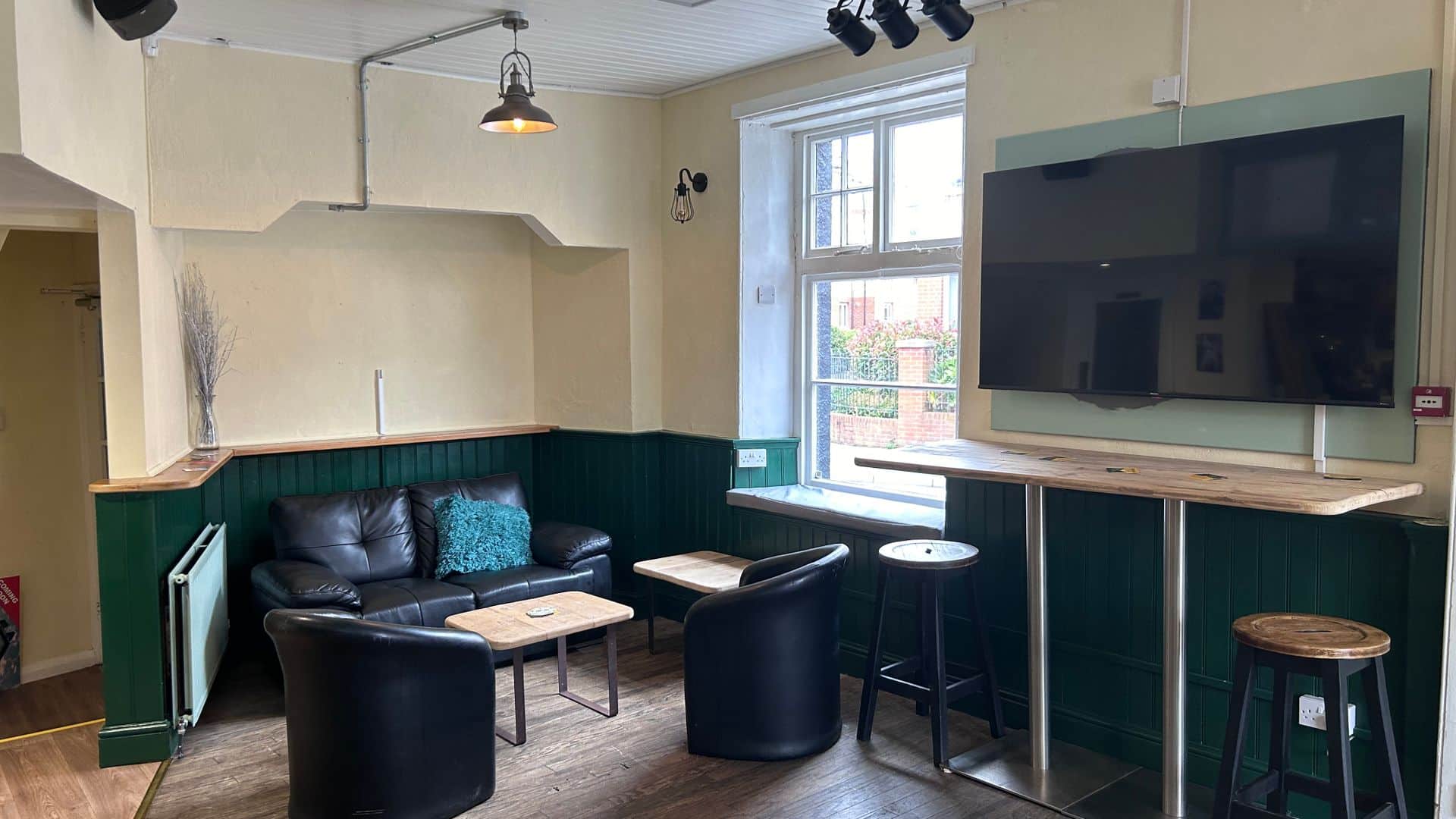 Seating with big TV,Rolle Quay Inn